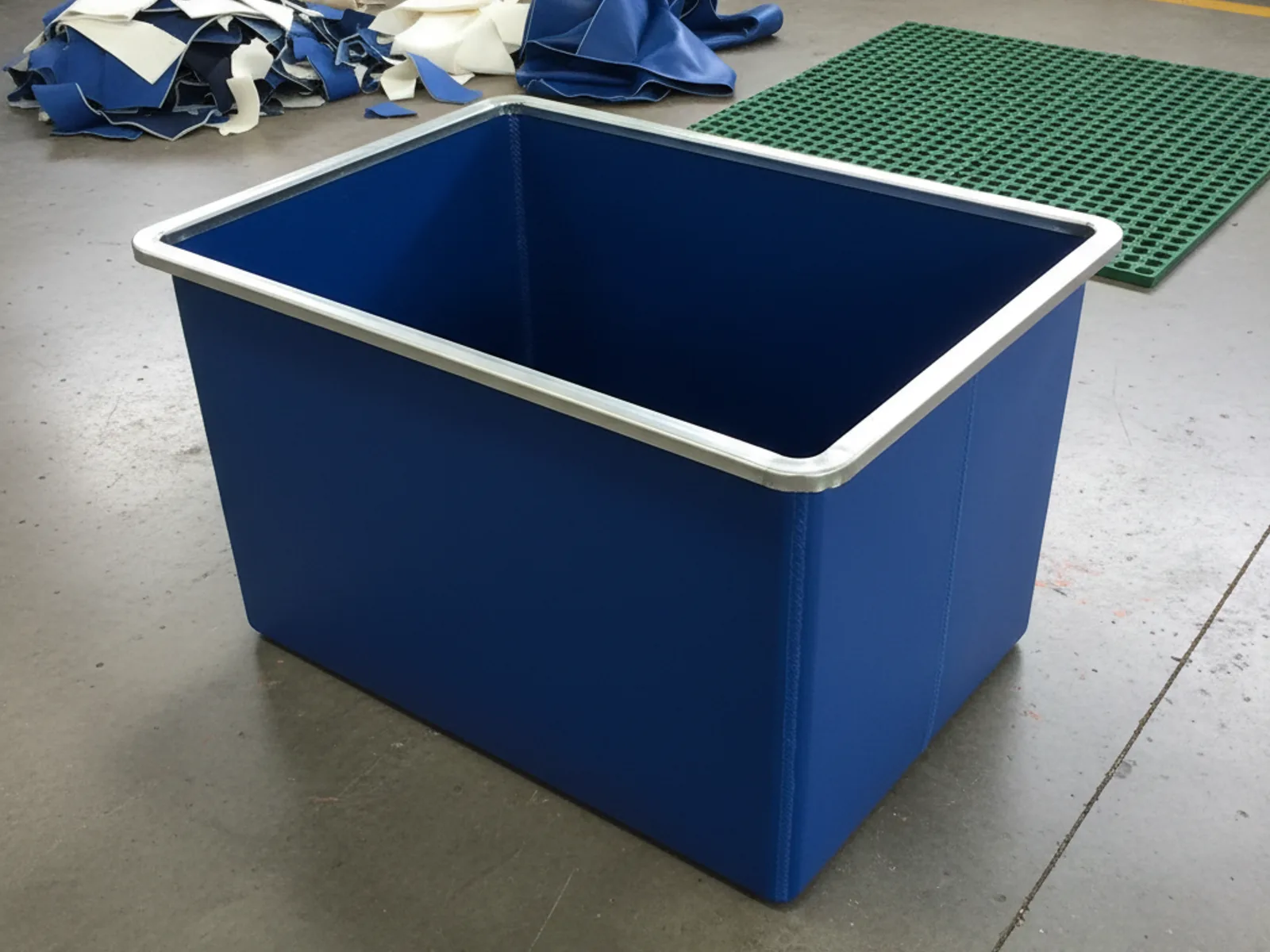 Rectangular cobalt-blue PVC ice bath with galvanised steel rim on the Minurphy factory floor
